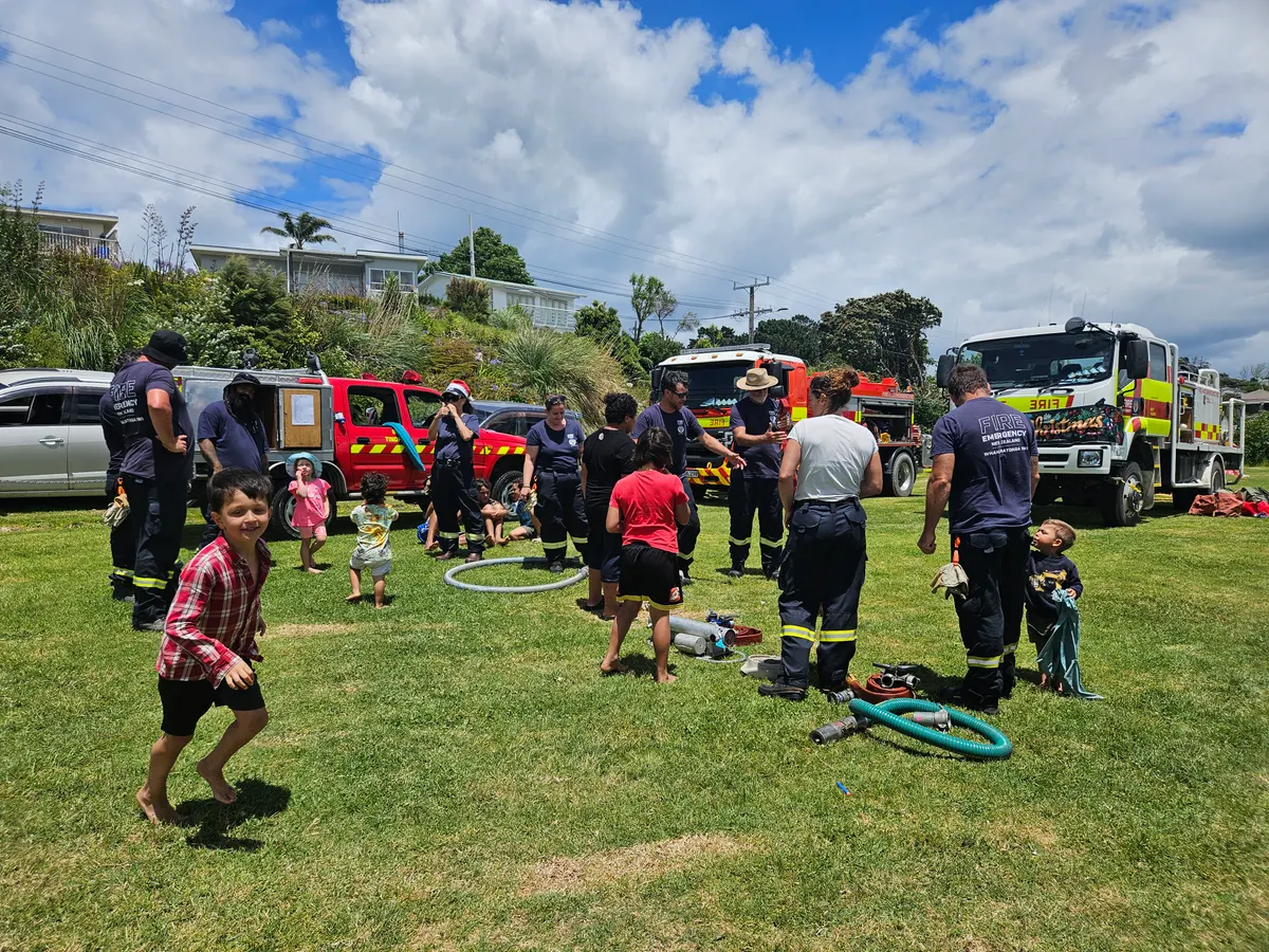 Tinopai children and Fire & Emergency volunteers at a community gathering